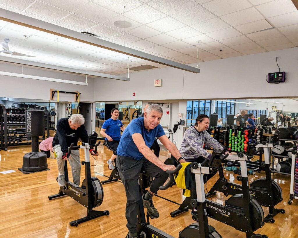 Members exercising on bikes